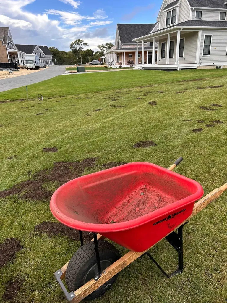 Top-dressing soil being applied to a Martha's Vineyard lawn