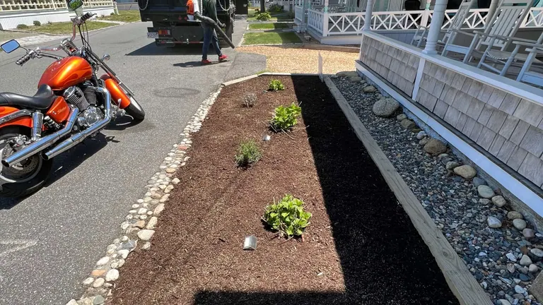 Fresh mulch and crisp bed edges along a Martha's Vineyard property