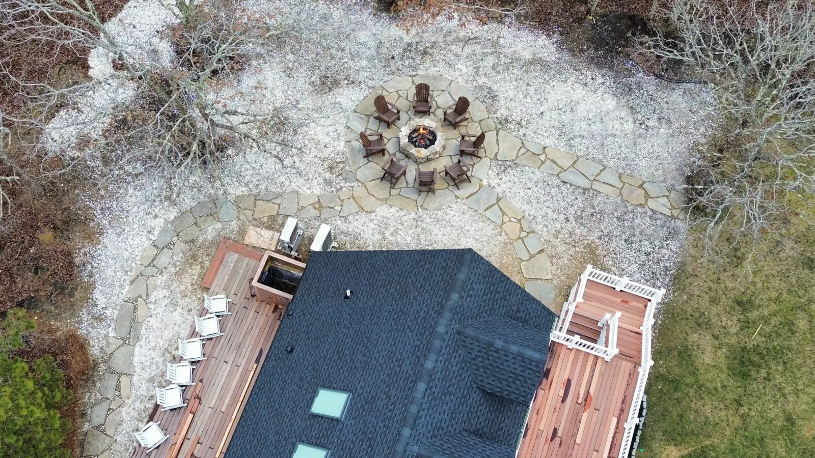 Finished fire pit area and planting from the four-zone landscape improvement