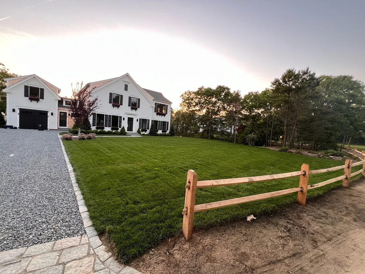 New-construction property with fresh sod lawn and fencing on Martha's Vineyard