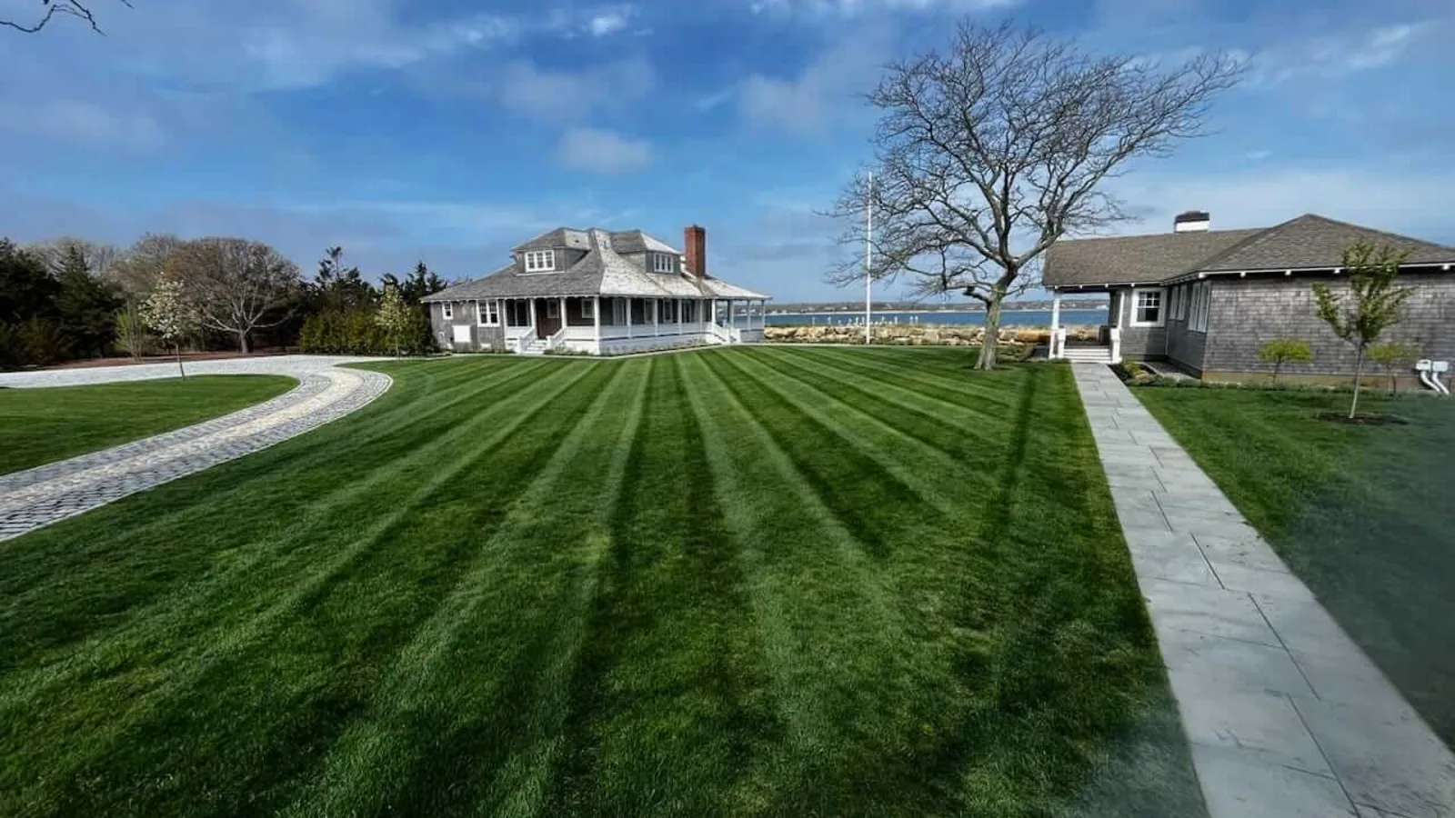 Freshly striped, healthy lawn beside a Martha's Vineyard home