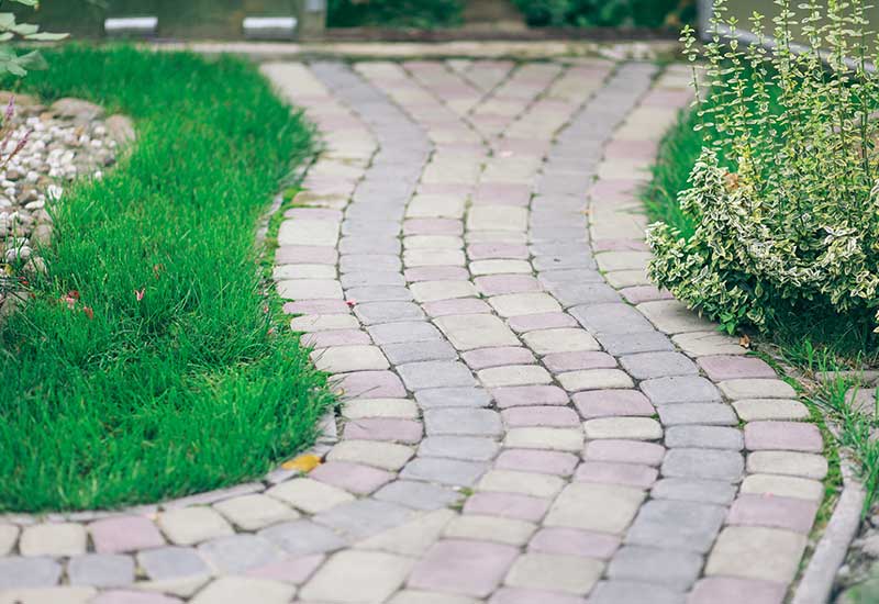 Graceful-walkways-connect-the-driveway-to-the-front-door-and-garden-