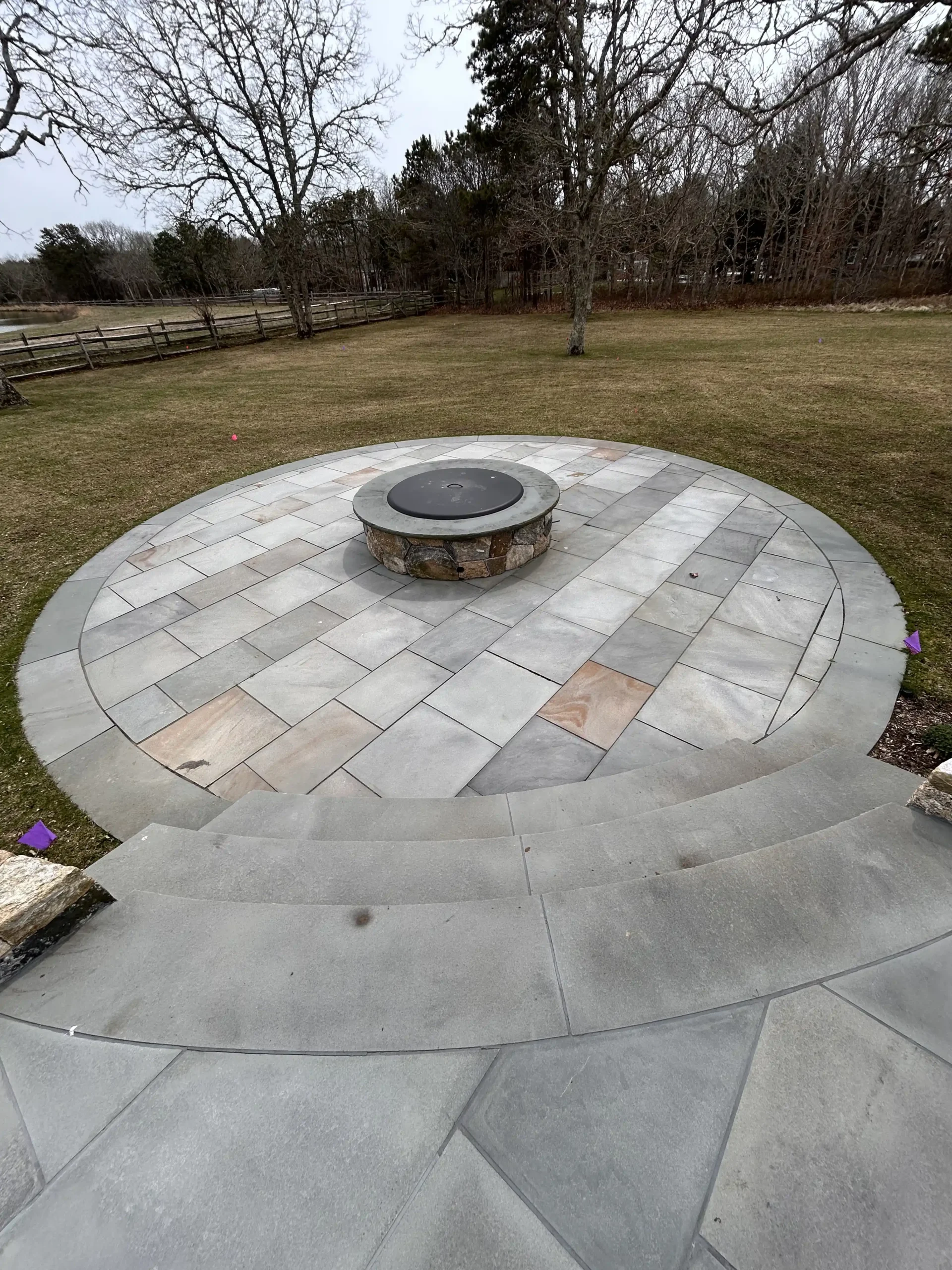 Veneered fire pit installation creating a custom outdoor gathering space on Martha’s Vineyard