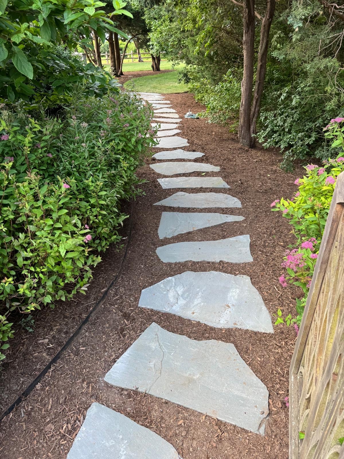 Garden path stepping stones installed through landscaped beds on Martha’s Vineyard