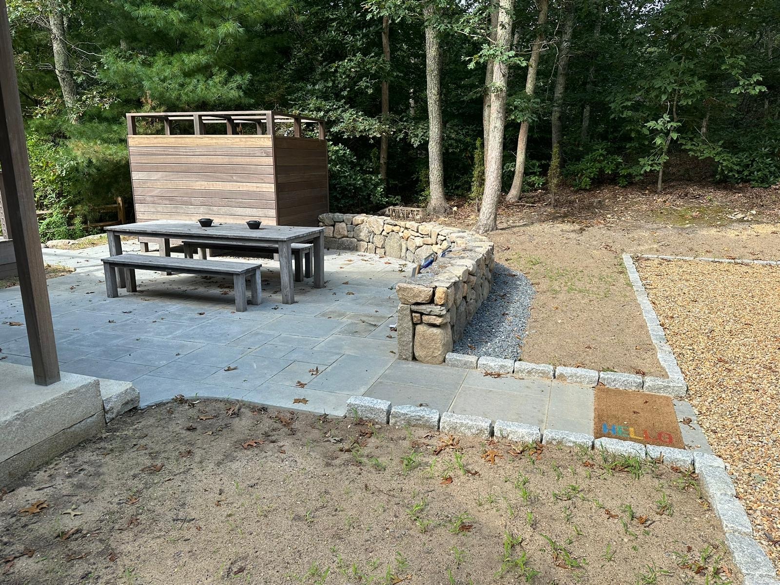 Fieldstone retaining wall installation providing natural structure on a Martha’s Vineyard property