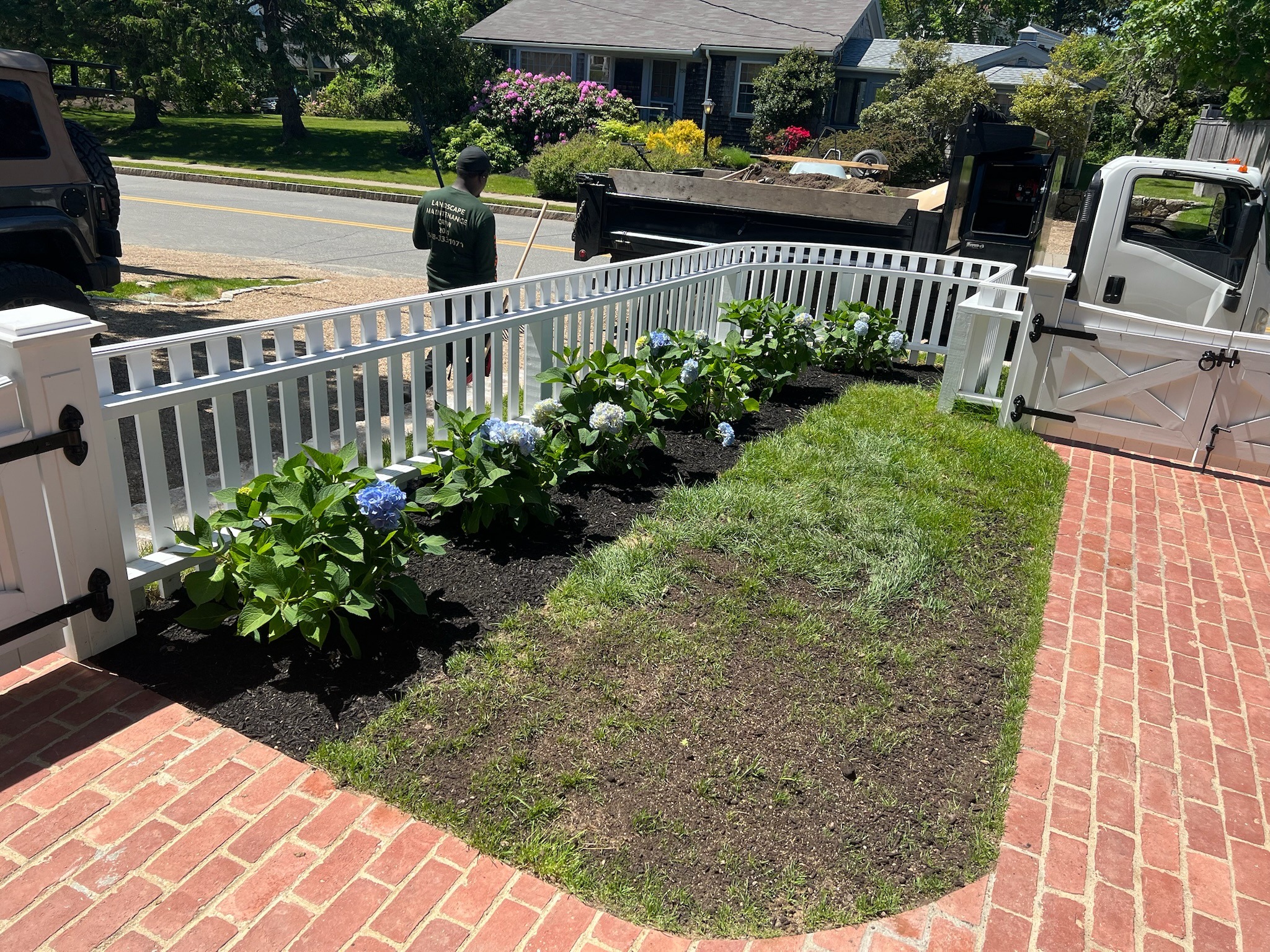 Seeding prep for an existing lawn to improve turf density on Martha’s Vineyard.