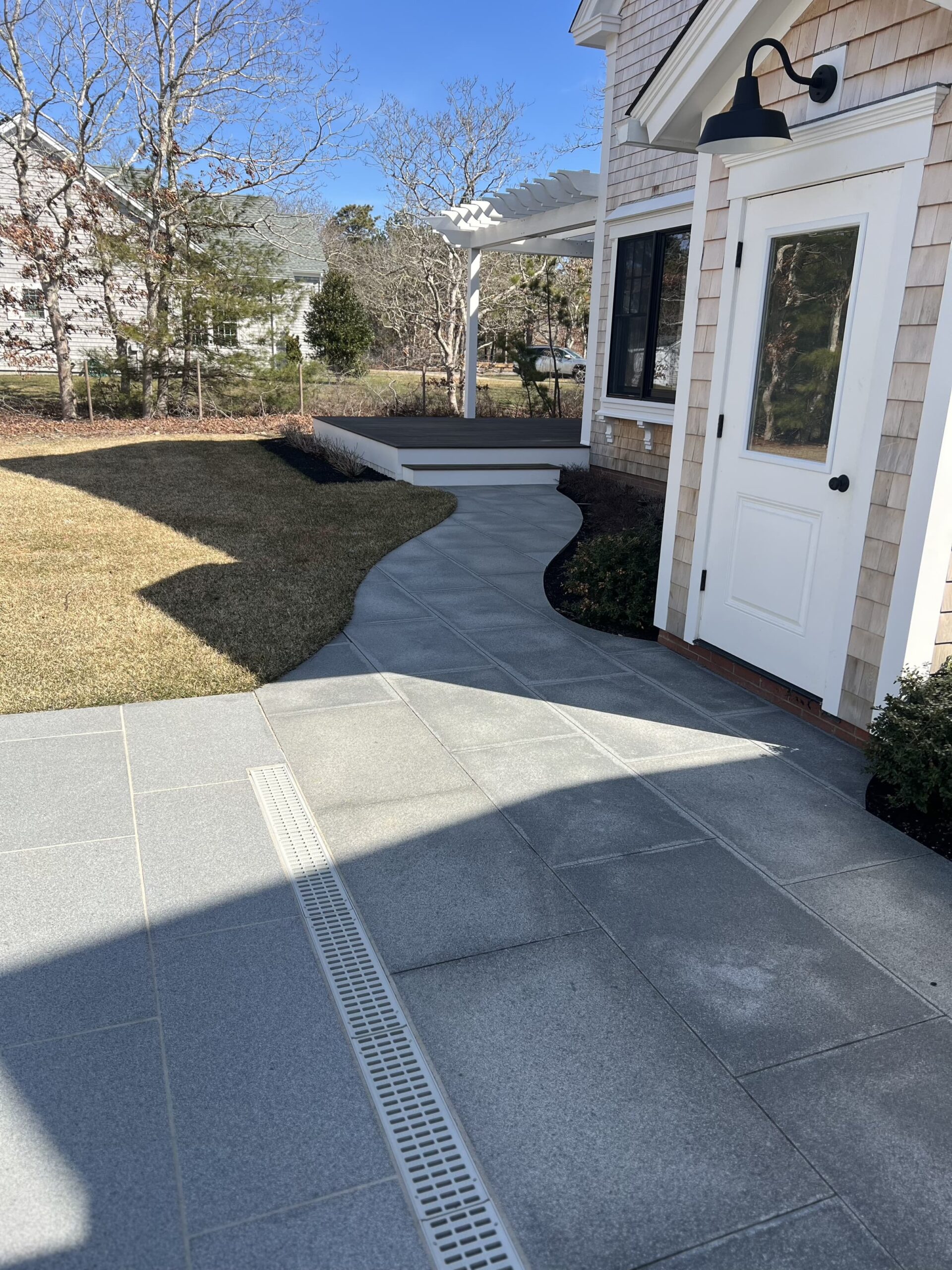 Curved walkway installation designed to follow landscape contours on Martha’s Vineyard