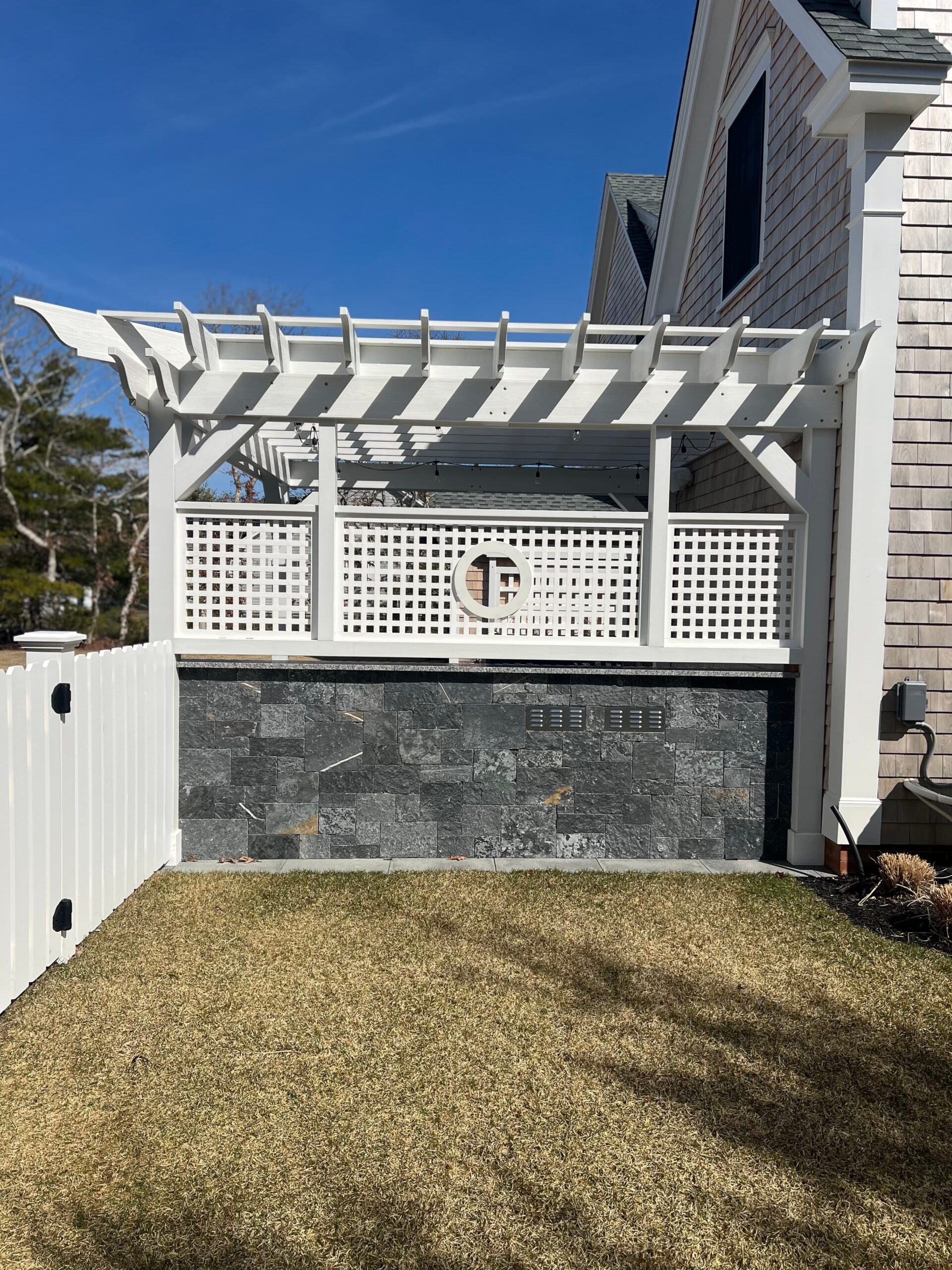 Manufactured stone veneer installation enhancing an exterior surface on Martha’s Vineyard