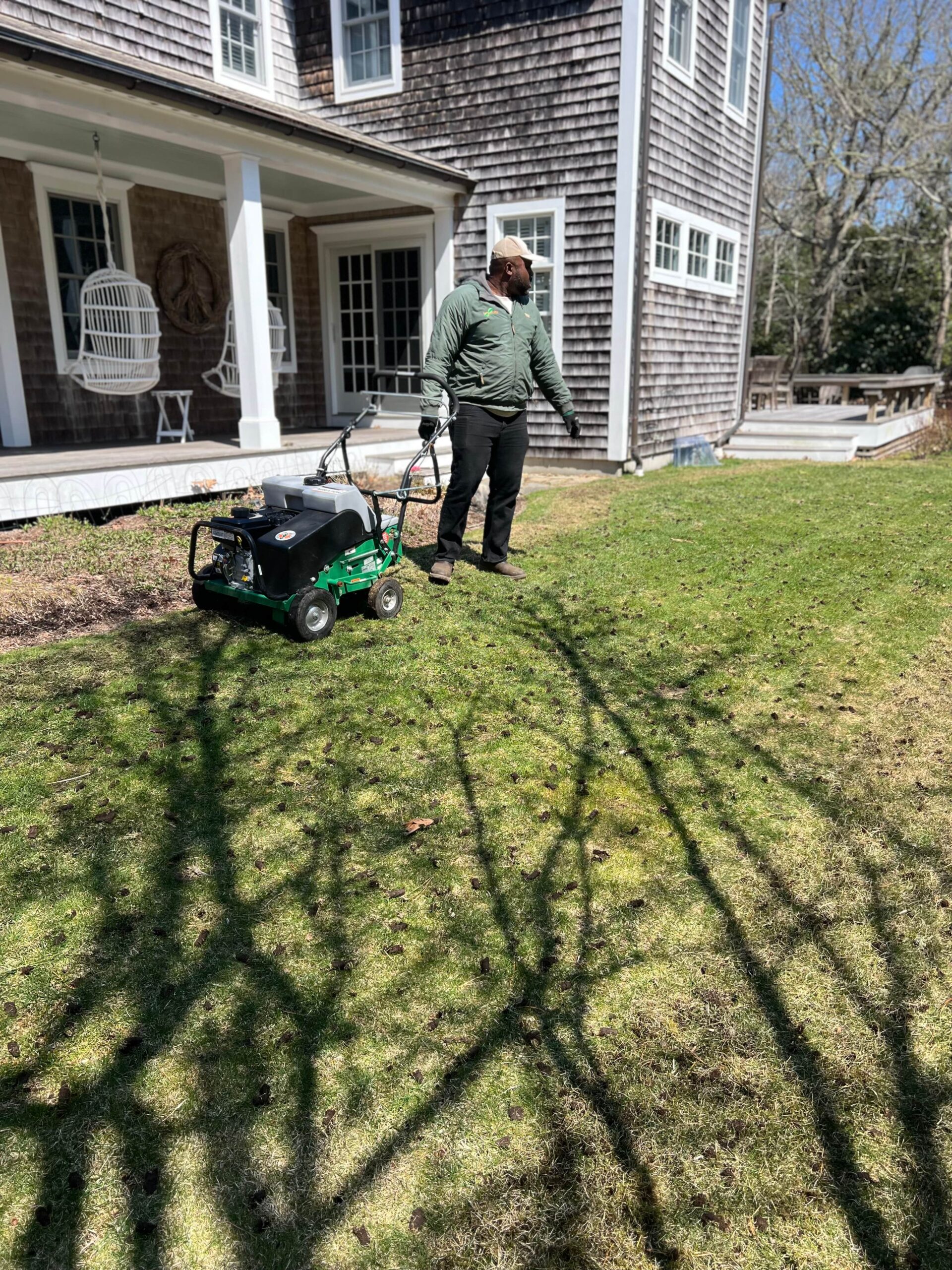 Professional lawn aeration service improving soil health on a Martha’s Vineyard property