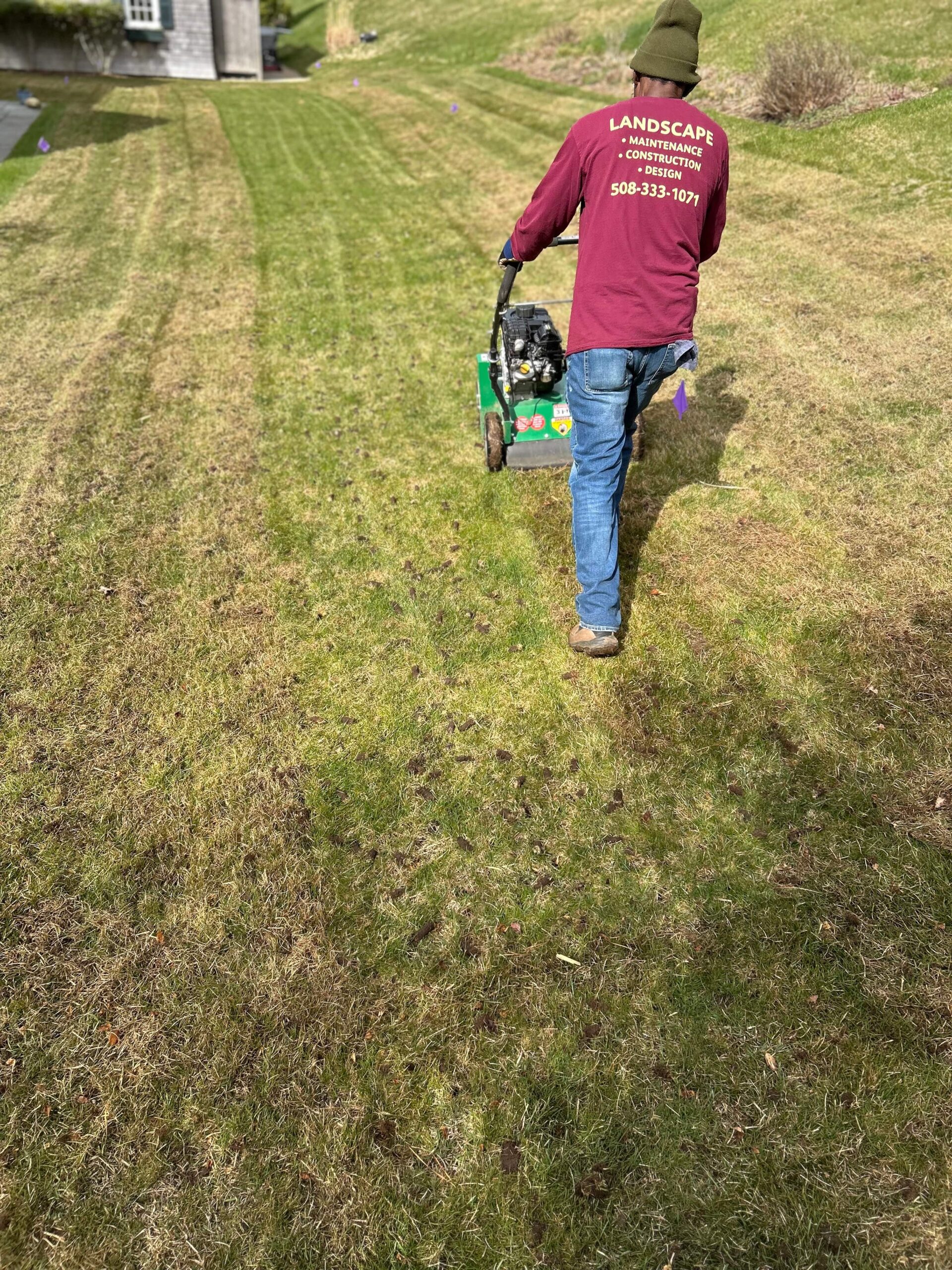 Lawn dethatching equipment removing excess thatch from turf on Martha’s Vineyard