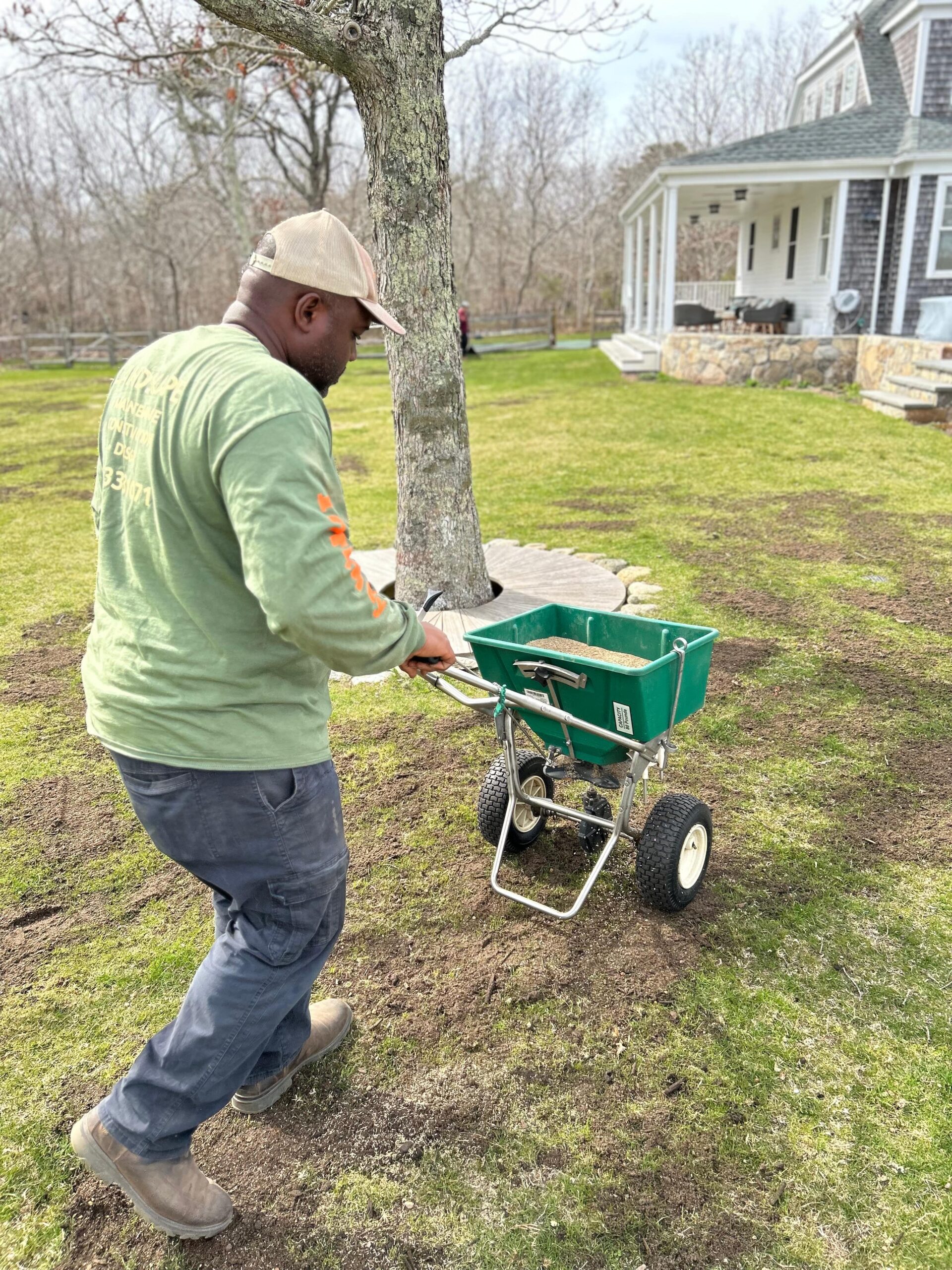 Professional lawn overseeding service improving turf density on a Martha’s Vineyard property