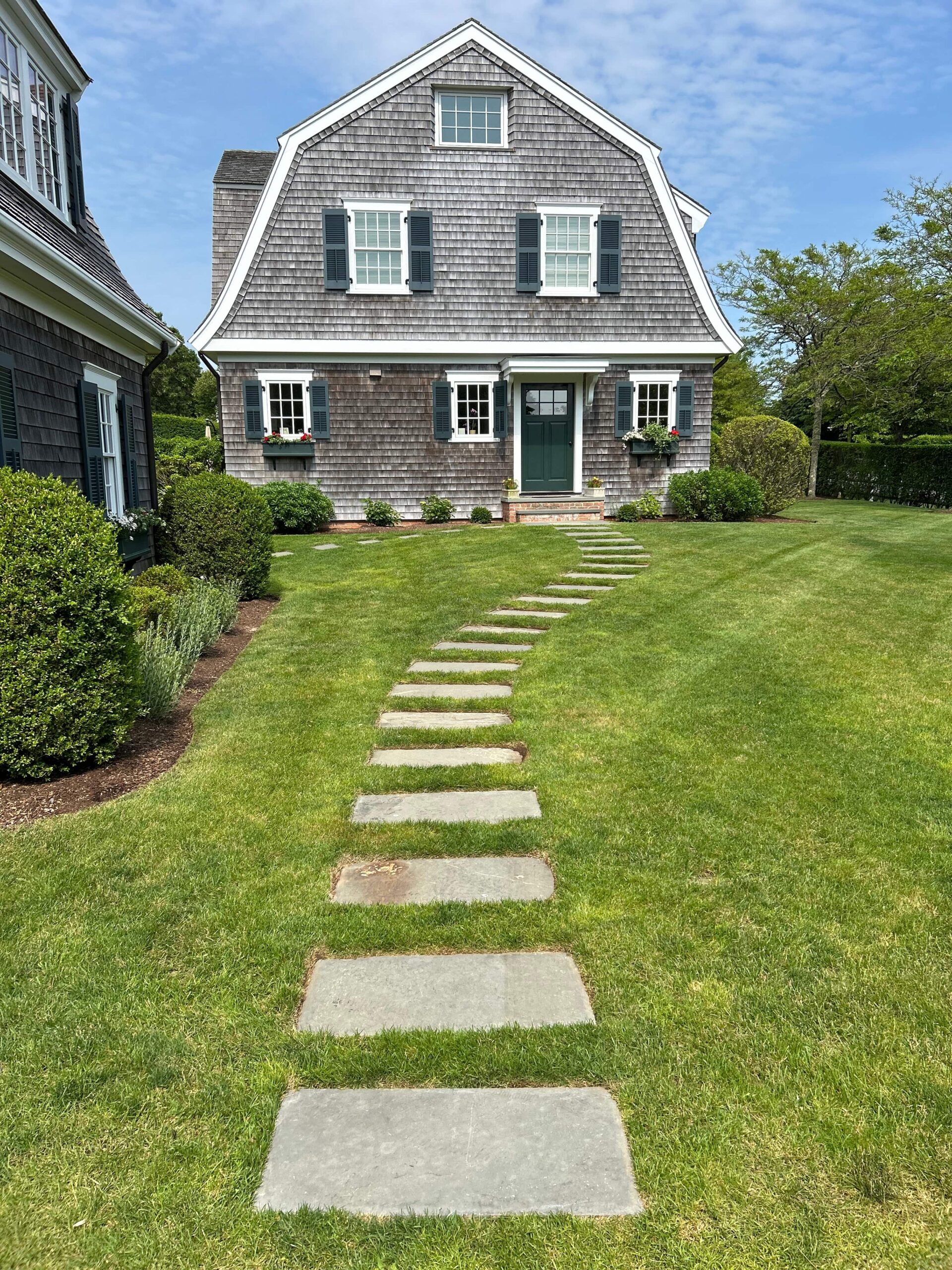 Stepping stone installation creating a path to front door entry on Martha’s Vineyard property