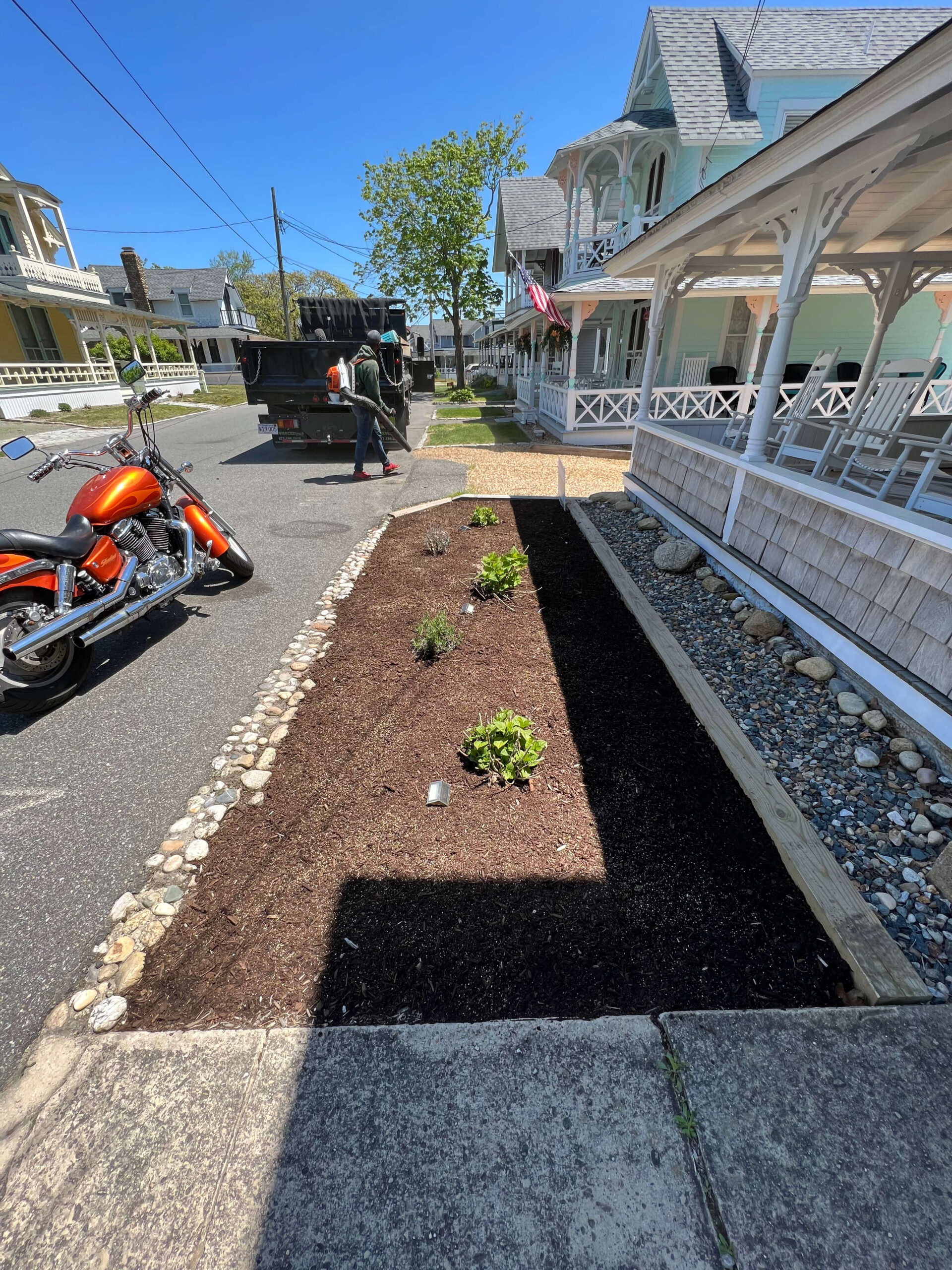 Plant bed maintenance mulching service in progress by professional landscapers on Martha’s Vineyard