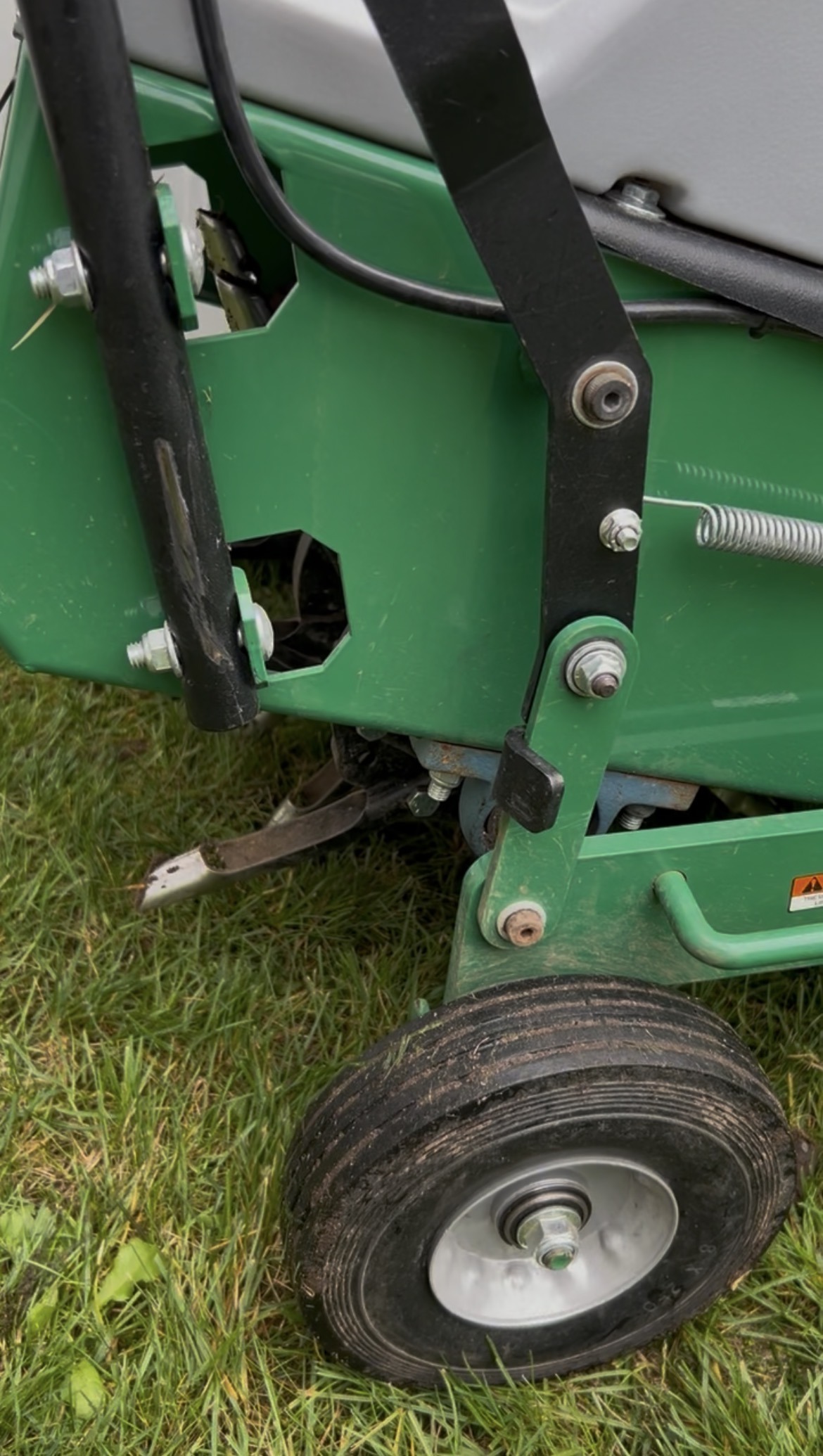 Core lawn aeration equipment removing soil plugs on Martha’s Vineyard