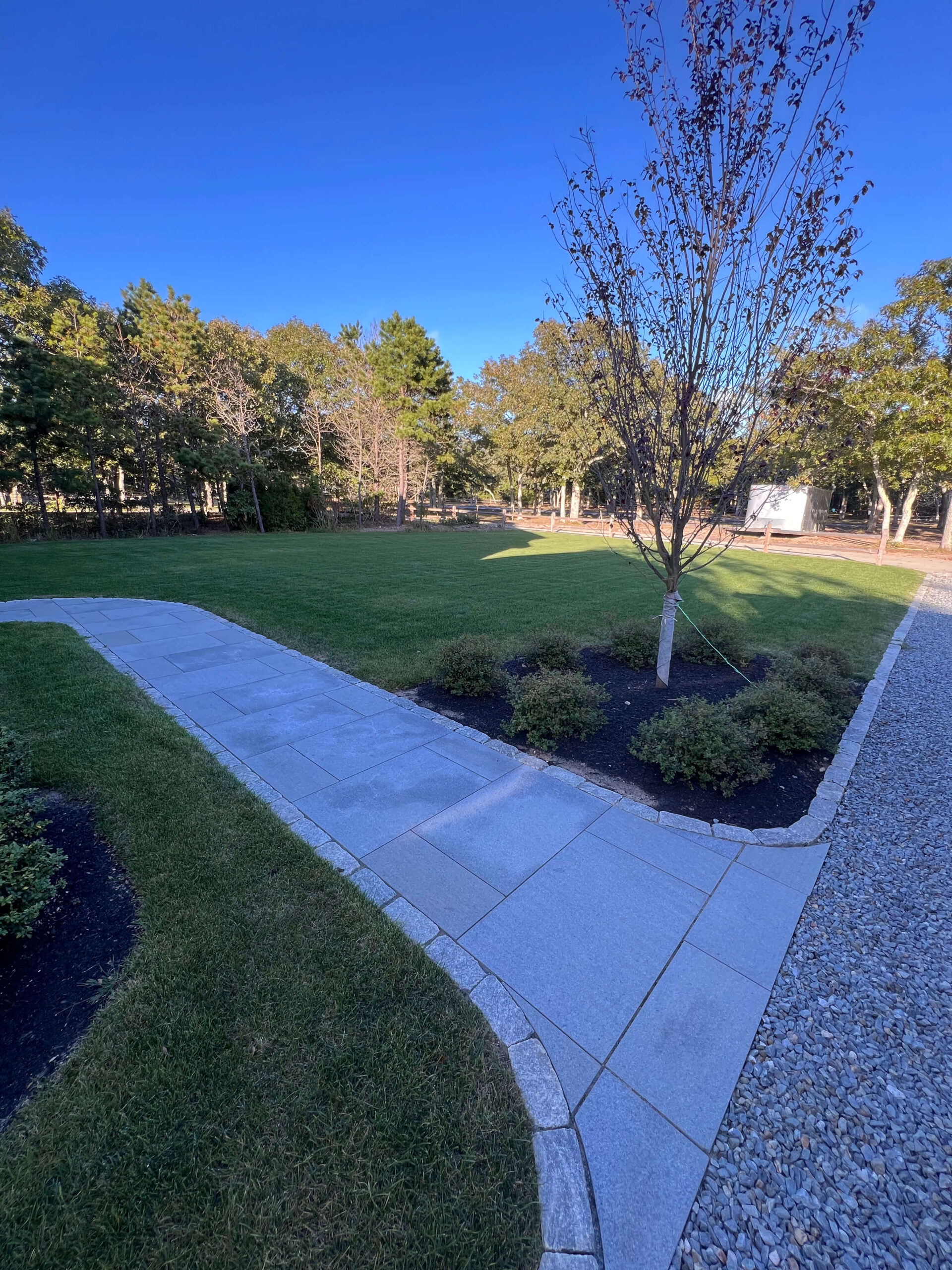 Cobblestone walkway edging installation by a professional landscaping company on Martha’s Vineyard