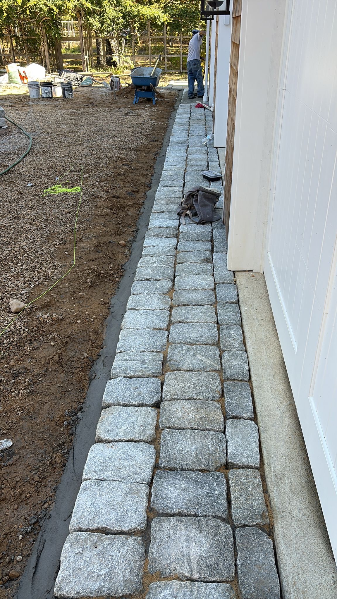 Cobblestone driveway apron installation in progress with base preparation on Martha’s Vineyard