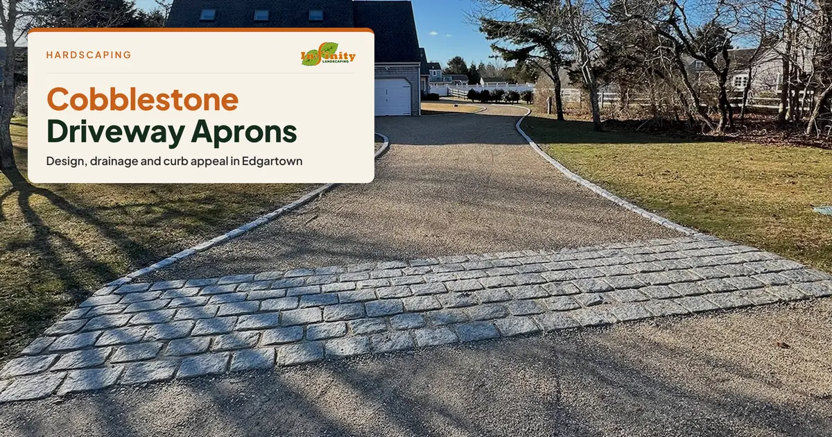 Granite cobblestone apron and edging on a gravel driveway to a house