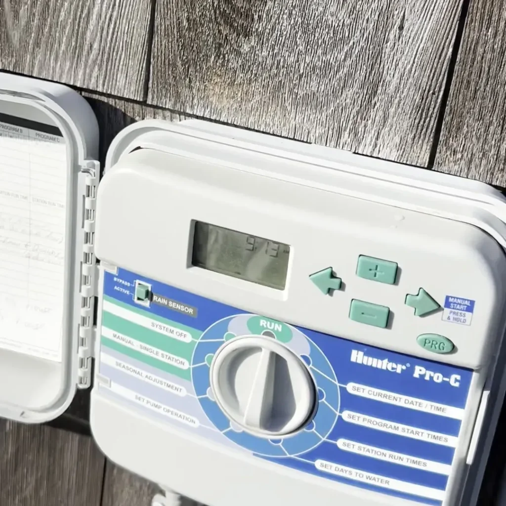 Hunter Pro-C irrigation controller with its dial and rain sensor switch
