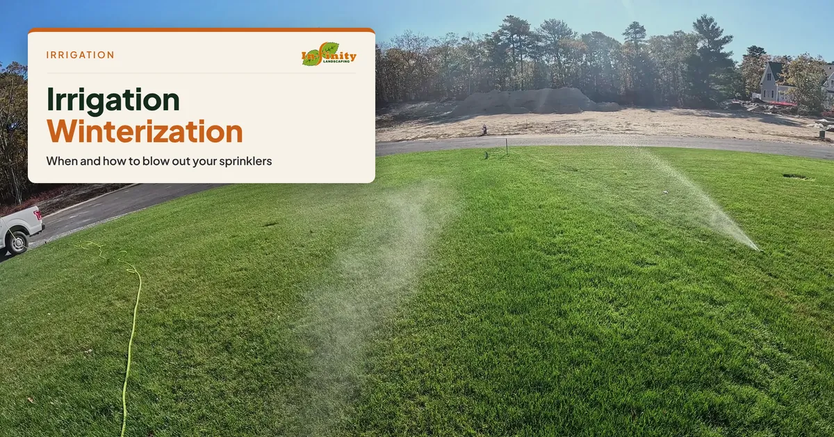 Air blowout mist rising from a sprinkler head across a green lawn